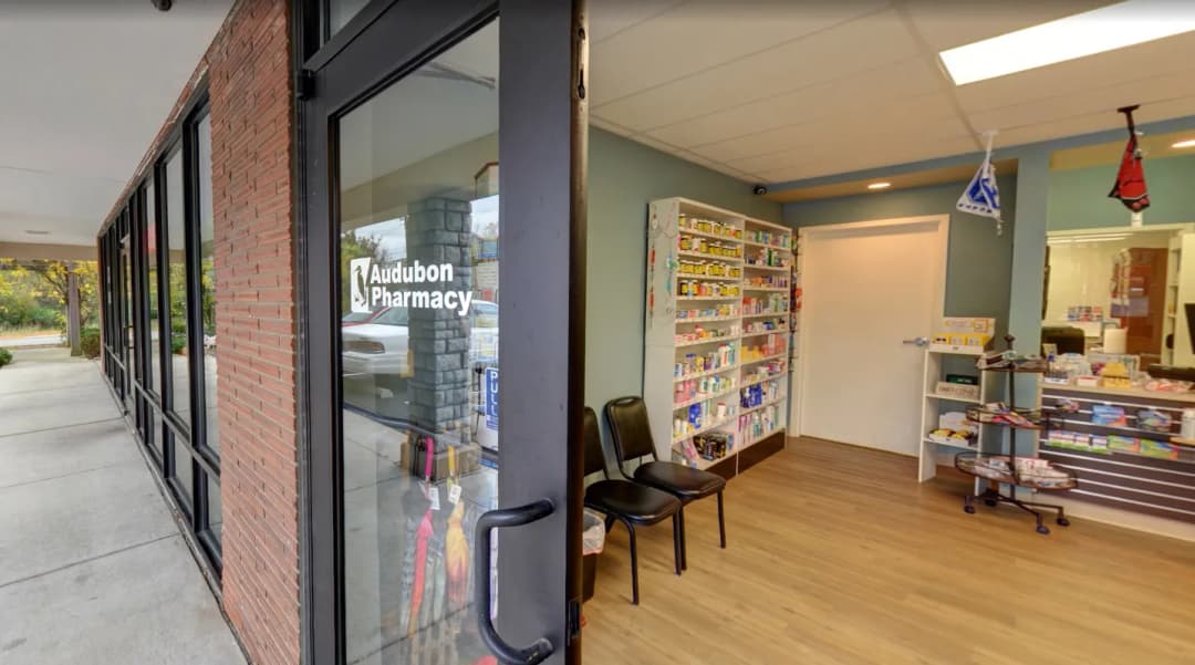 pharmacist greeting a patient inside Audubon Pharmacy